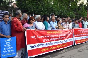 SNF and DWRN jointly formed human chain demanding workers safety by the amendment of Labour Law and increasing the amount of compensation